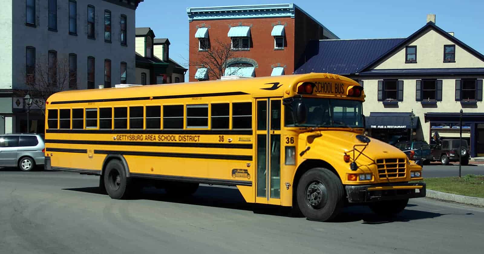 how many golf balls fit in a school bus